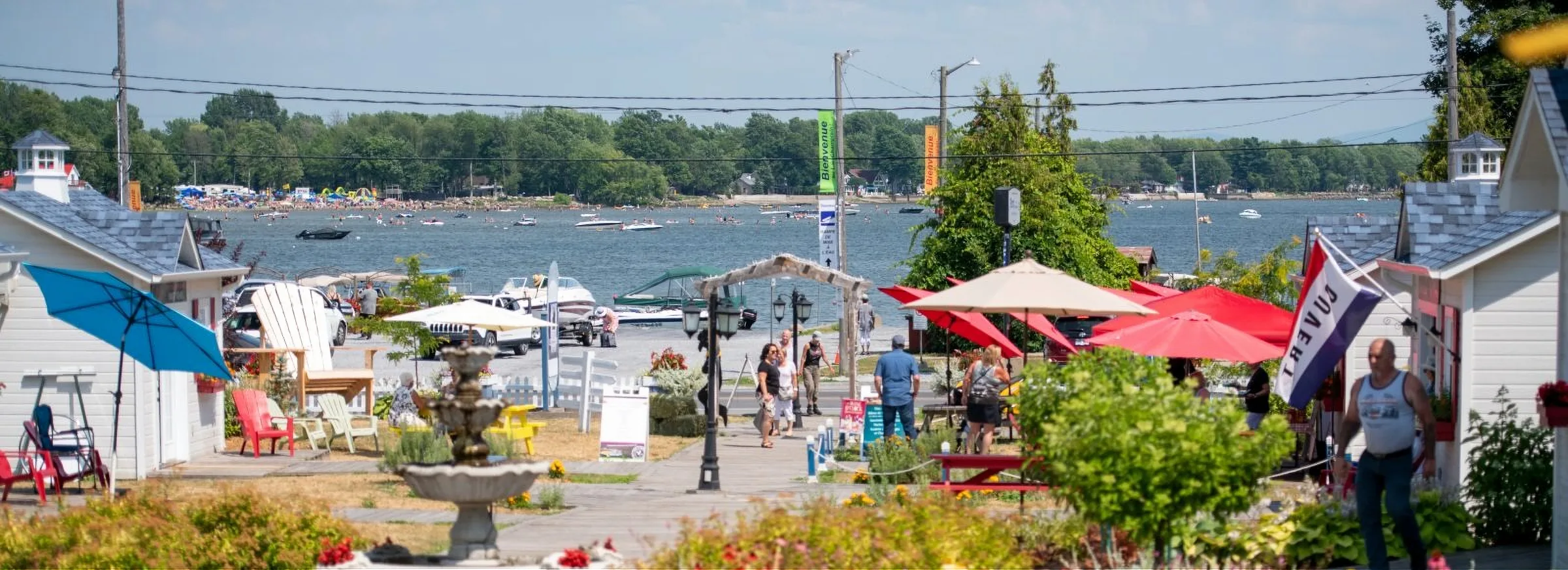 Venise-en-Québec village, café umbrellas and Lake Champlain